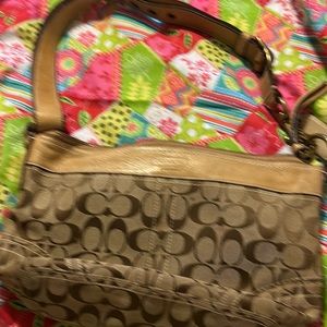 This vintage signature Coach handbag.